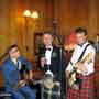 Andy, Derek Ward and Benni at Andy Becketts wedding, 20th Sep 2003. We played the Cramps Pussy do the Dog and Bennie had to play the base upside down as he was left handed.